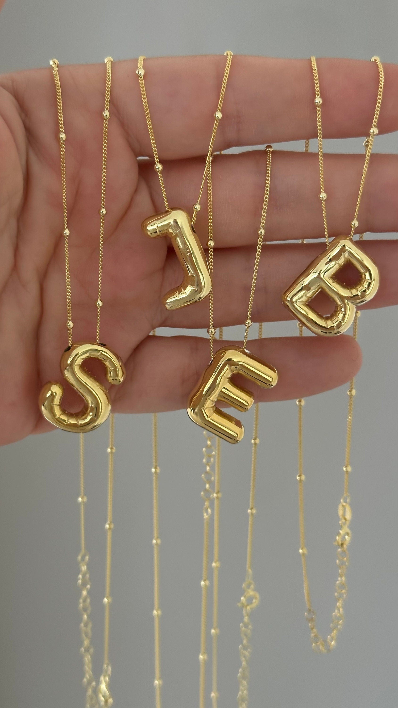 Trendy 3D balloon letter necklace featuring a bold, puffy bubble initial pendant. Crafted from 925 sterling silver with gold, rose gold, or rhodium plating. Perfect as a personalized gift or statement jewelry piece.