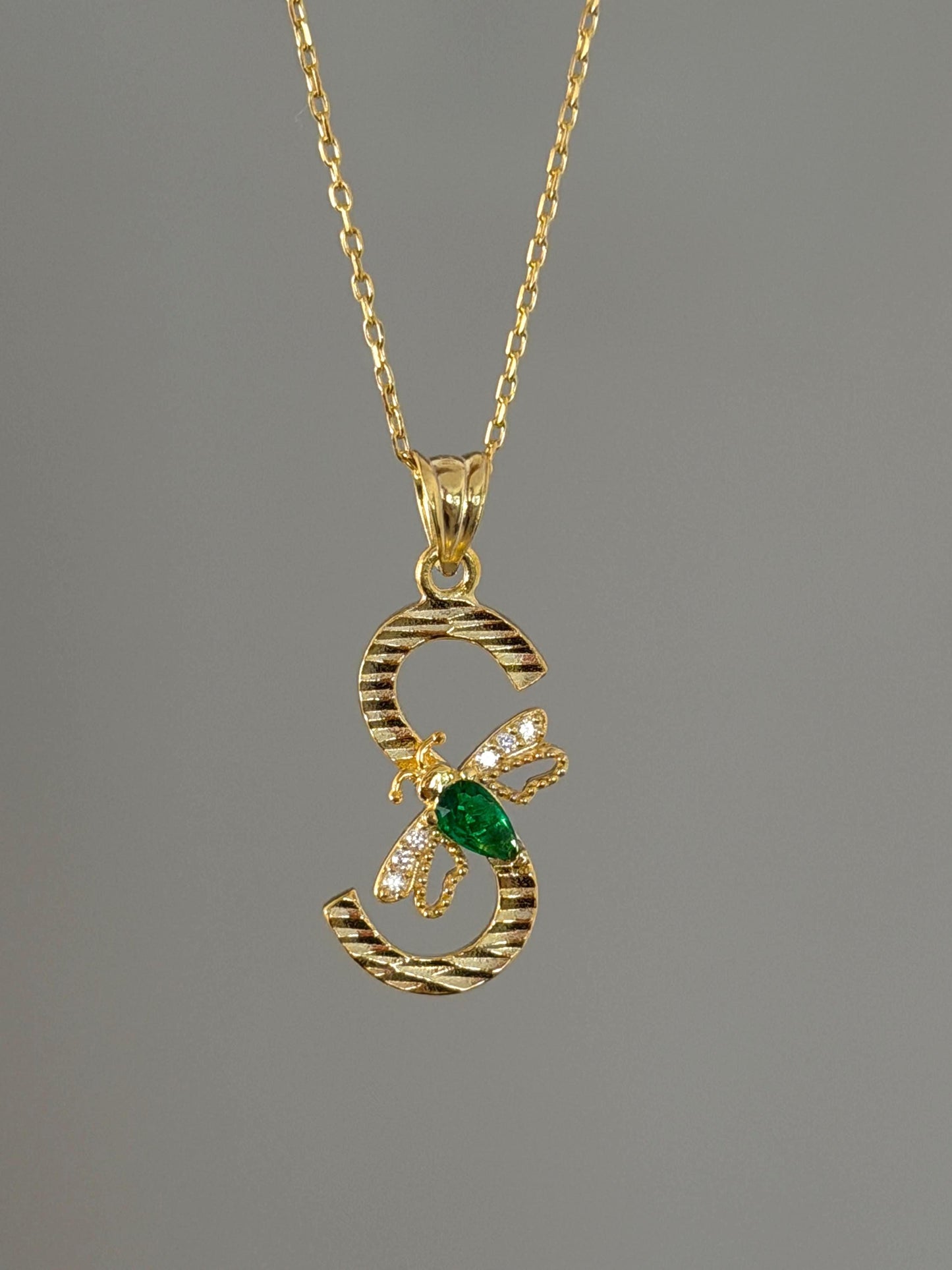 Custom birthstone diamond letter pendant necklace with bee detail.