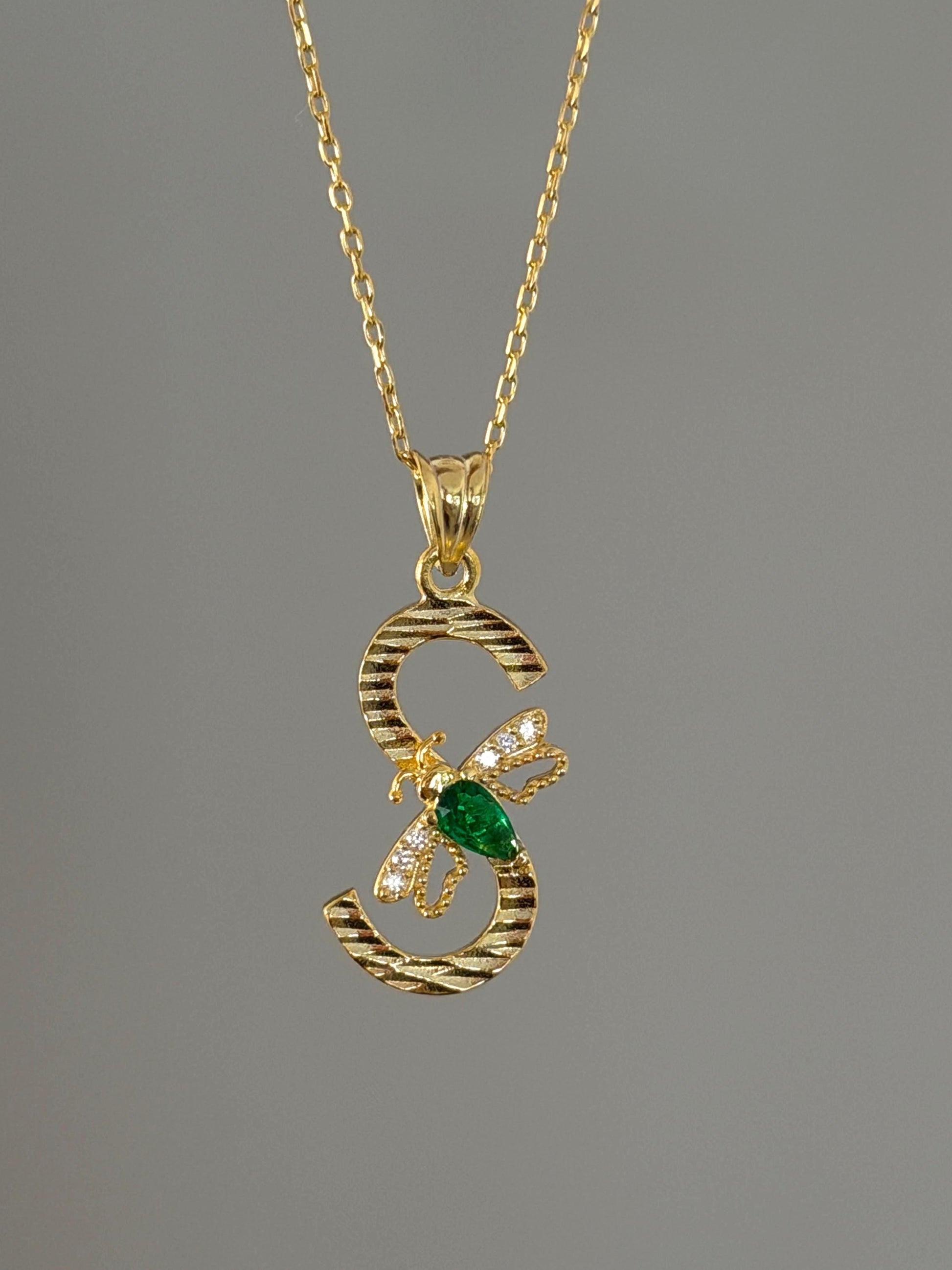 Custom birthstone diamond letter pendant necklace with bee detail.