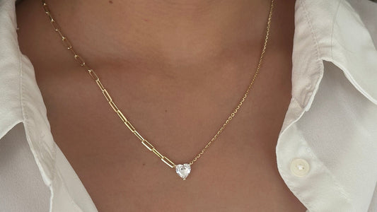 A gold chain necklace with a heart-shaped pendant featuring a clear gemstone. The chain is made of two different styles, one with a more delicate chain and the other with a thicker, more chunky chain. 925 Sterling Silver 14k Gold Plated - CZ Diamond - Handmade Jewelry