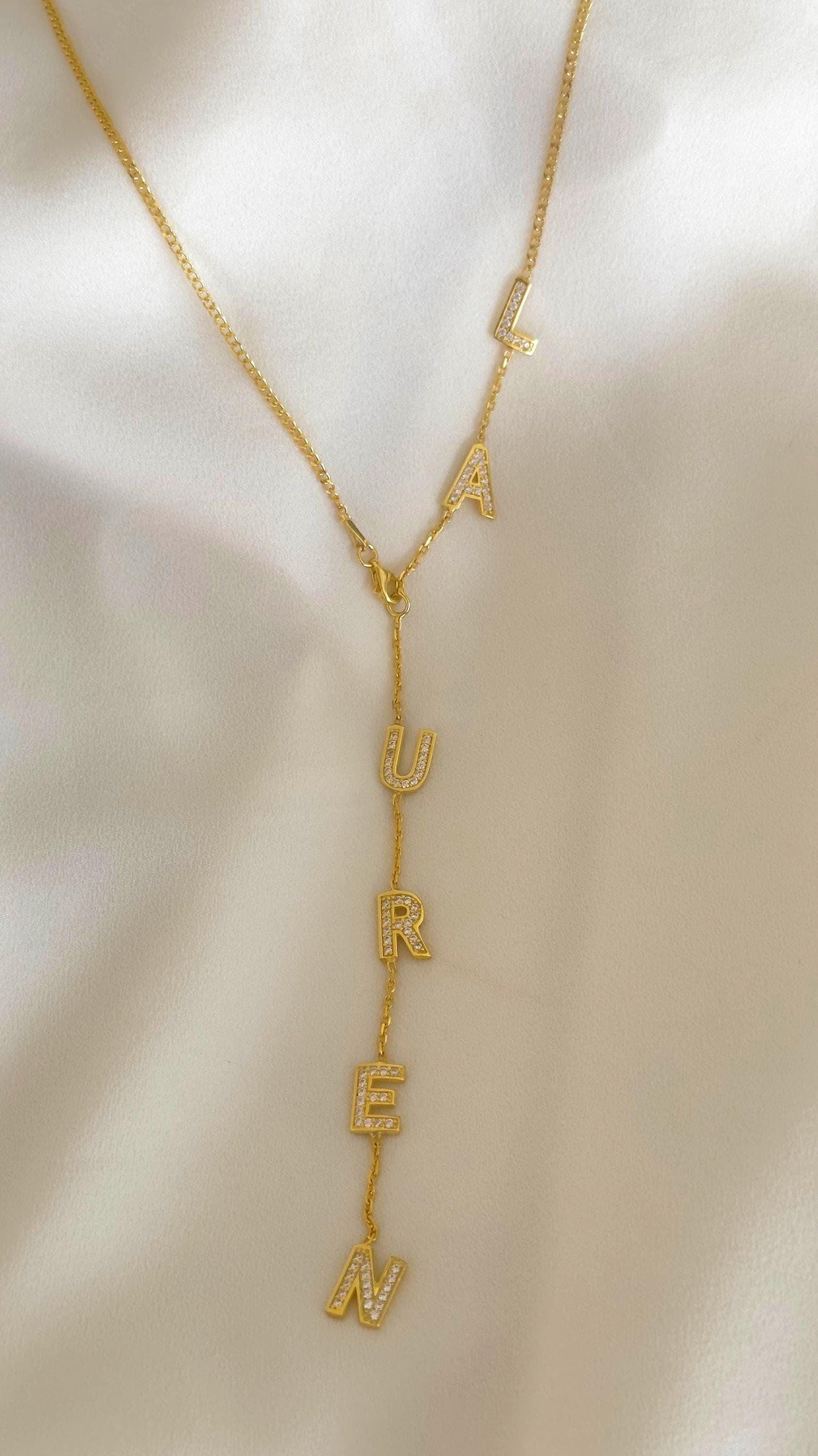Custom Y-shape drop necklace in silver with clear CZ gemstone letters, dainty and elegant personalized jewelry for women.