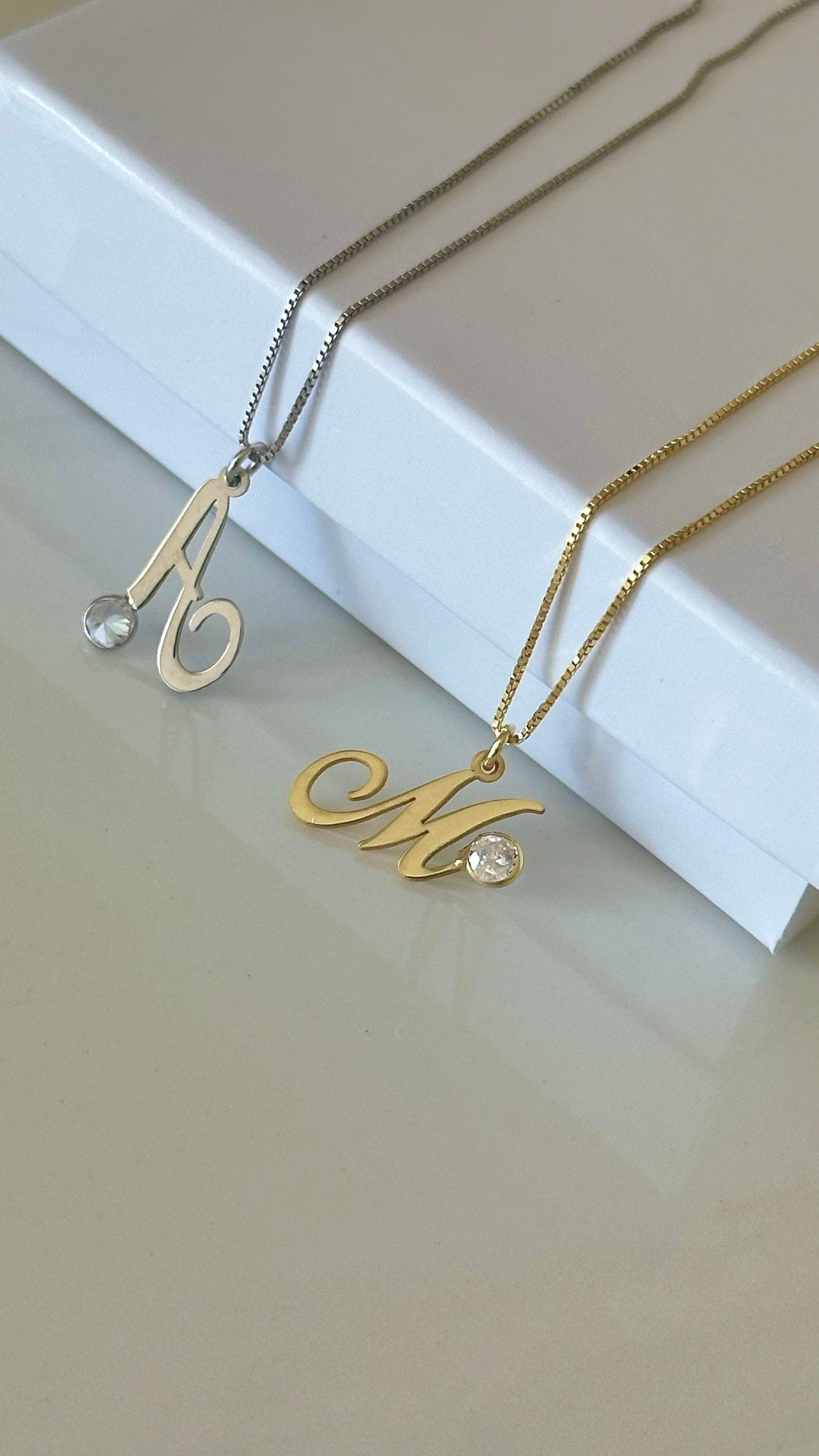 Close-up of 925 sterling silver initial diamond pendant necklace, handcrafted personalized design by Shineliz