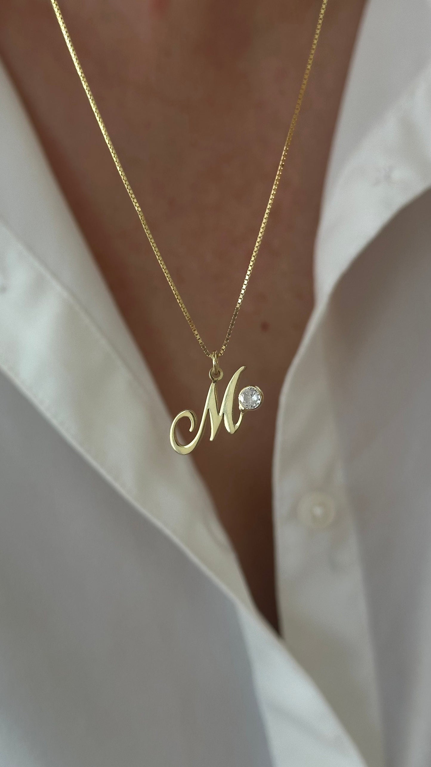 Custom initial necklace with sparkling round CZ gemstone on a delicate box chain, minimalist everyday jewelry gift for women.