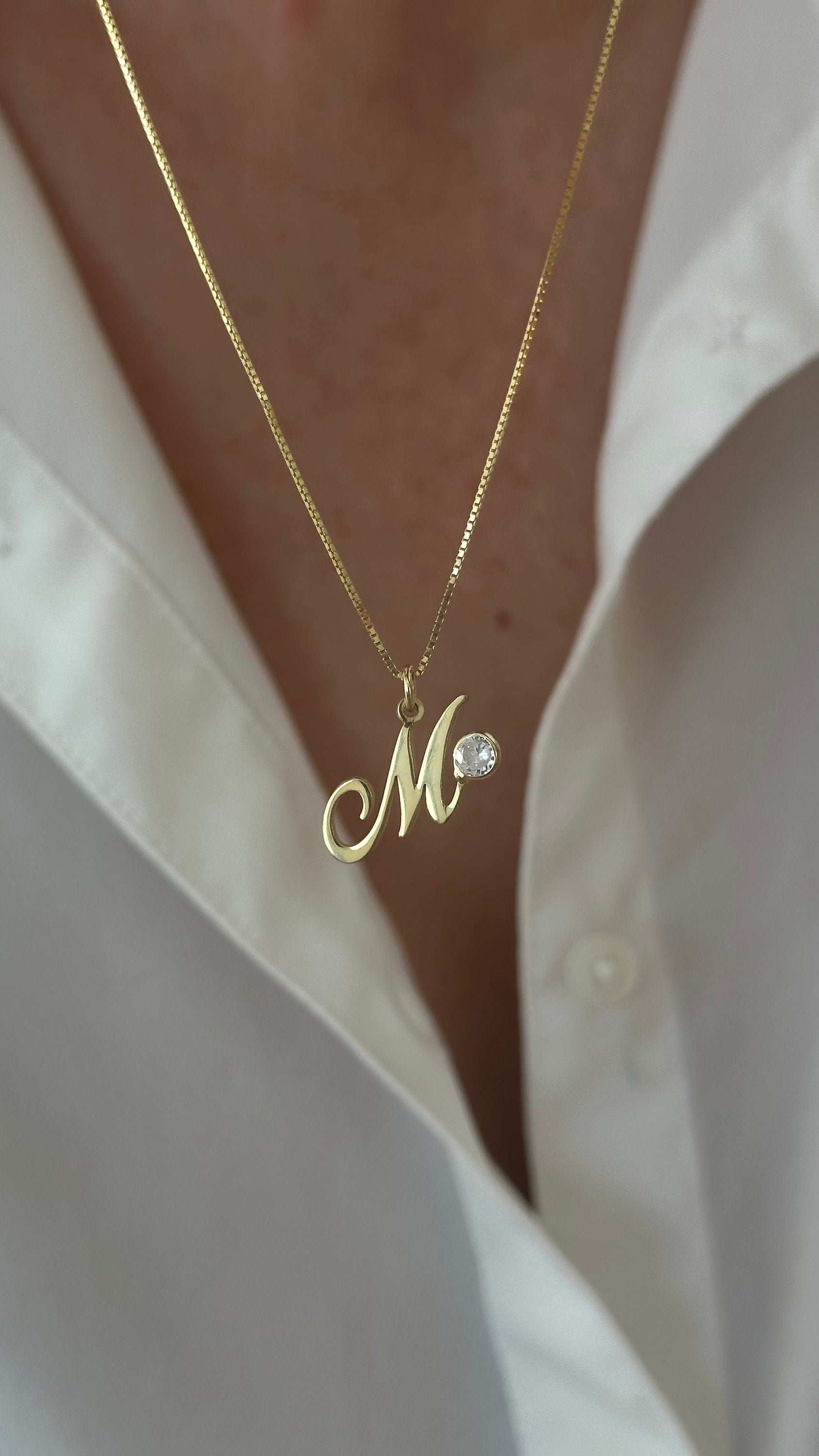 Custom initial necklace with sparkling round CZ gemstone on a delicate box chain, minimalist everyday jewelry gift for women.