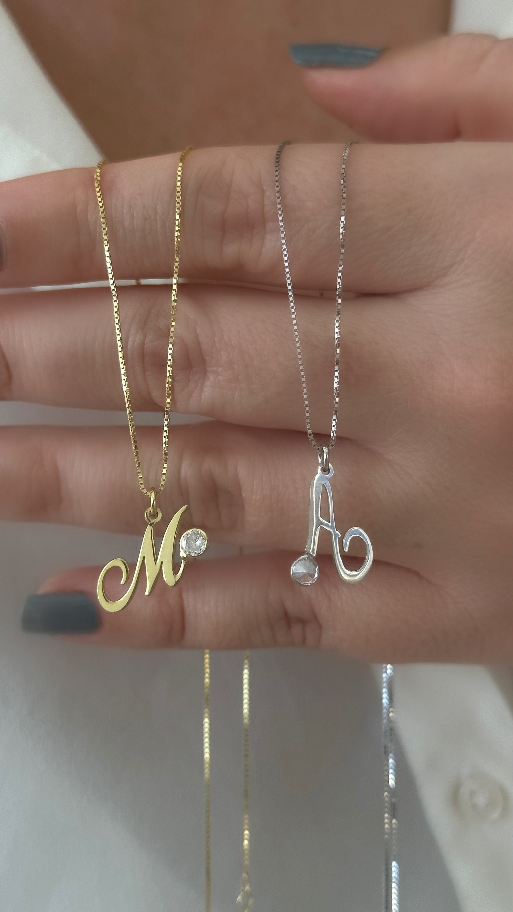 Sterling silver initial necklace with round cubic zirconia charm, simple and stylish custom jewelry.