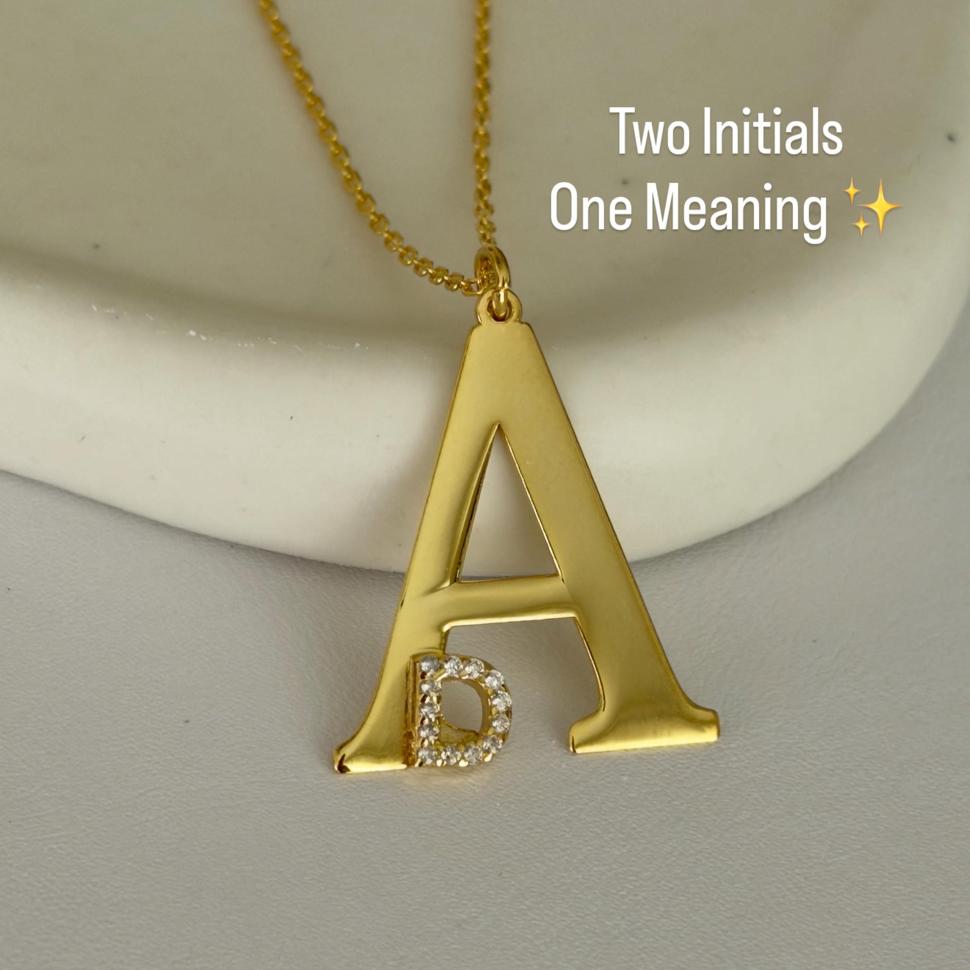 Two initial meaningful necklace in matching gold tone with elegant design