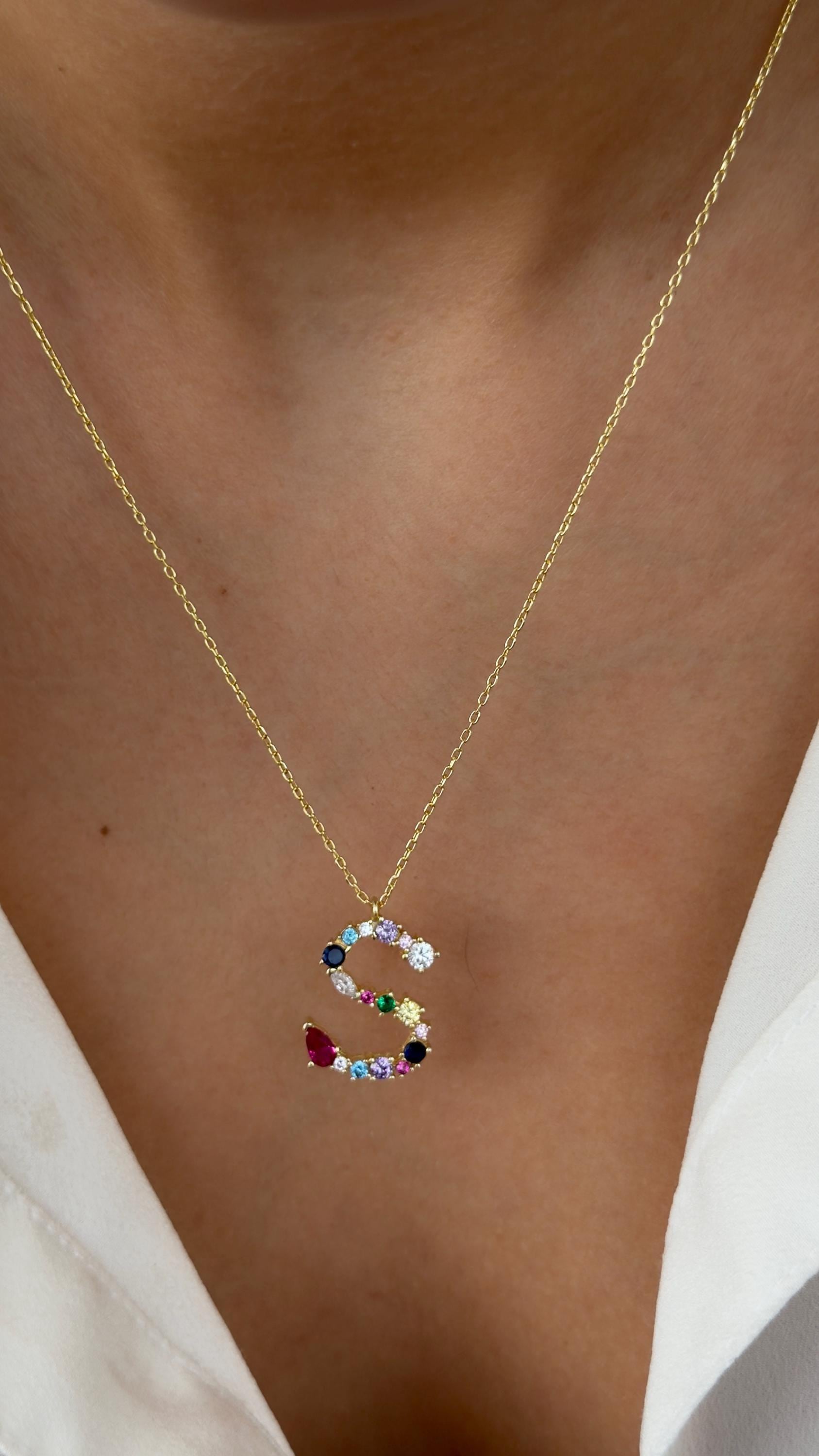Colorful diamond initial necklace in sterling silver. Custom letter pendant with multicolor CZ gemstones. Perfect personalized jewelry gift for women.
