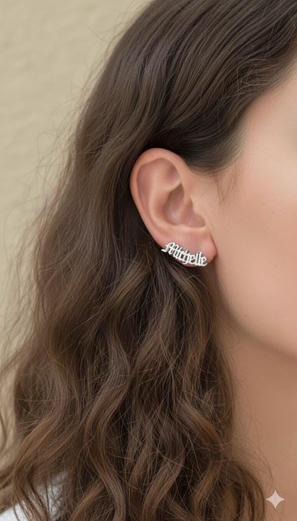 Minimalist name stud earrings handcrafted in sterling silver.