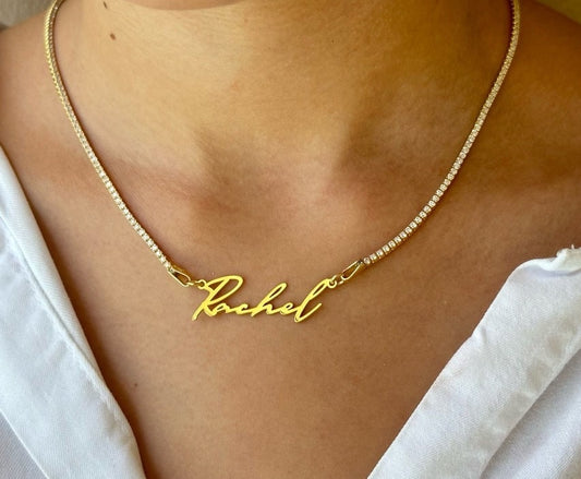 Elegant custom name tennis necklace featuring a 1.5mm CZ diamond tennis chain and personalized nameplate pendant. Made with solid 925 sterling silver and plated in 14K gold, rose gold, or rhodium. Perfect gift for her ‚Äî birthdays, anniversaries, bridesmaids, and holidays.