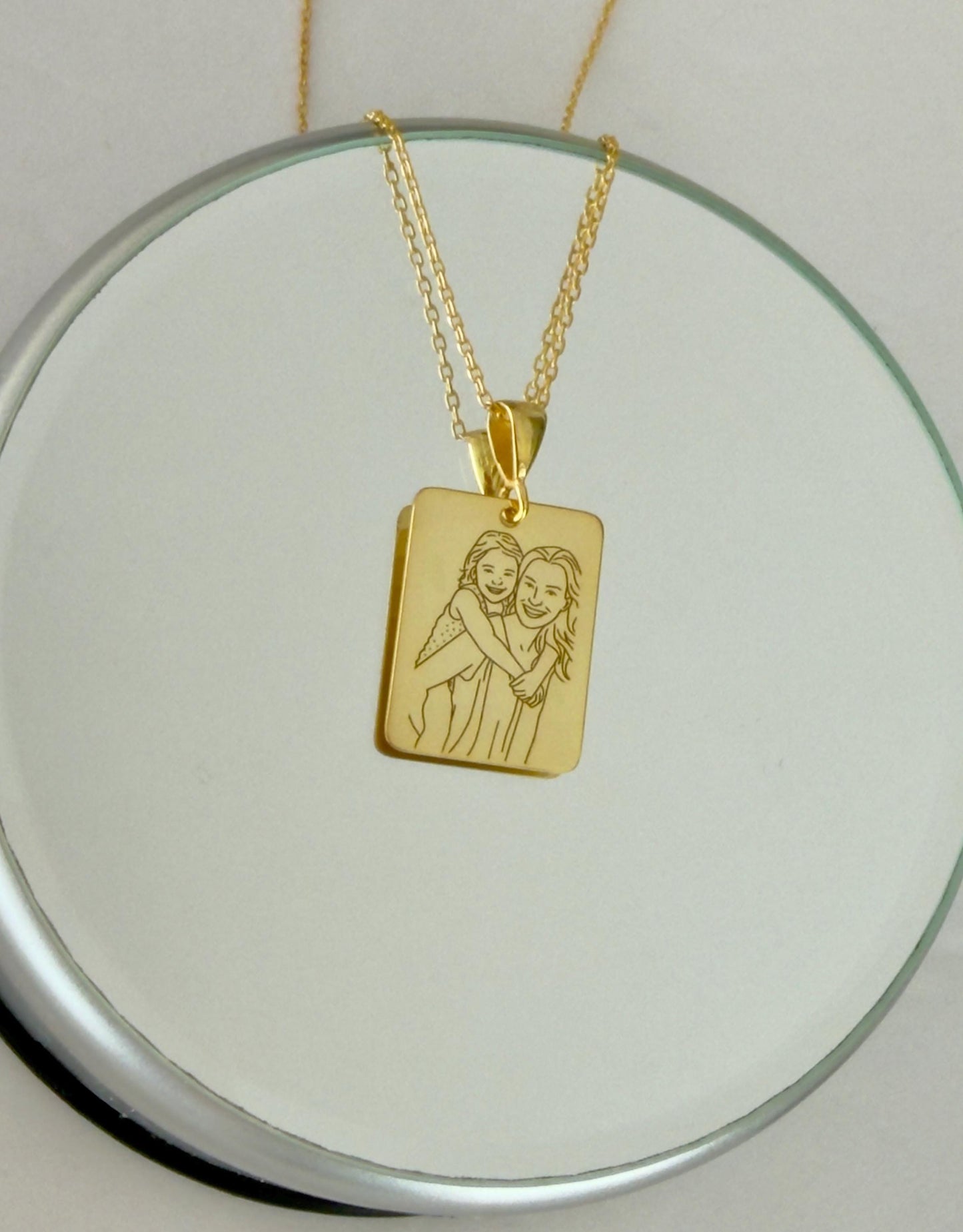 Detailed engraving on custom picture necklace pendant.