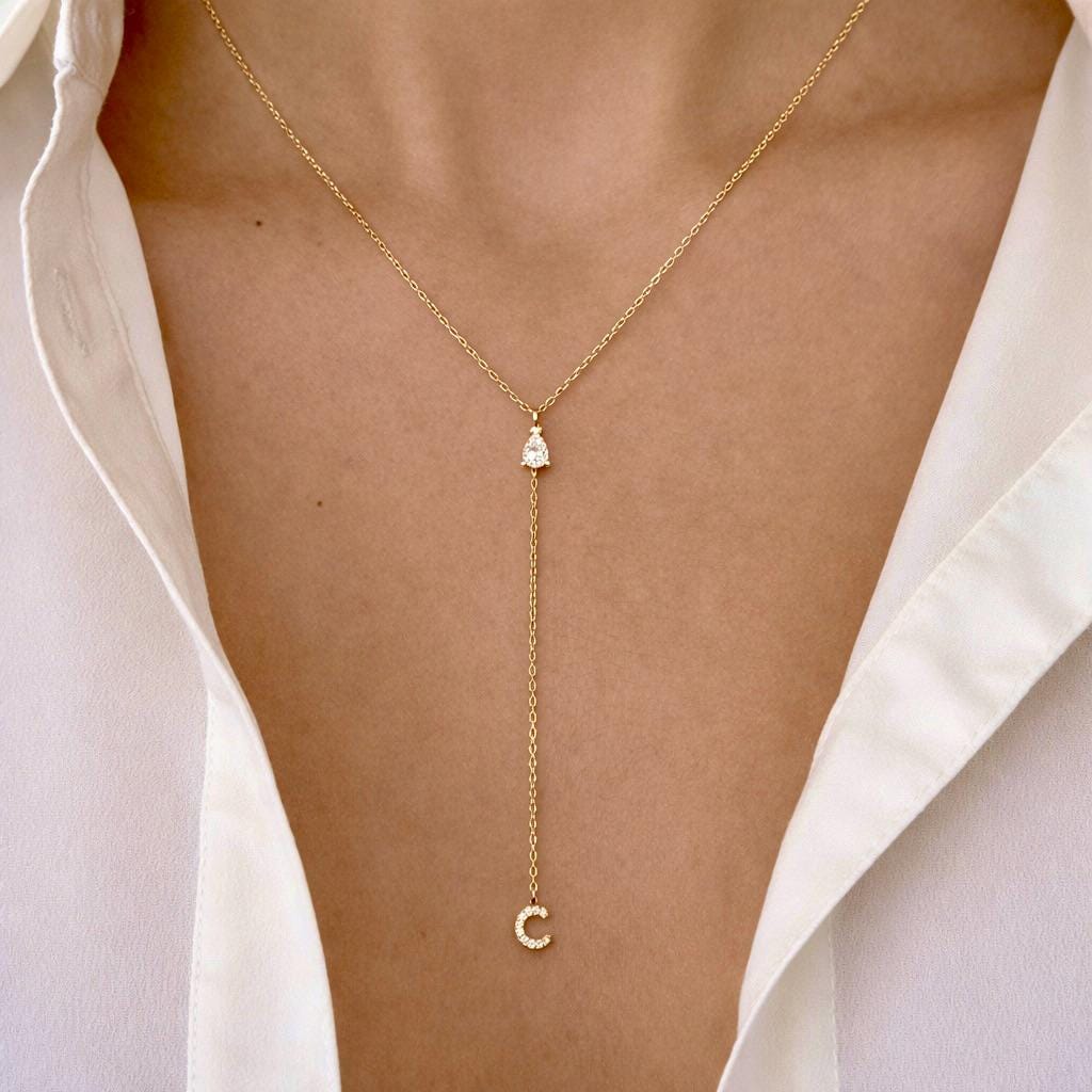 Gold lariat initial necklace with letter C pendant worn by woman, delicate personalized jewelry gift for her minimalist style
