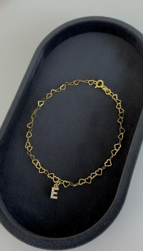 Close-up of mini heart link chain detail on custom initial bracelet.