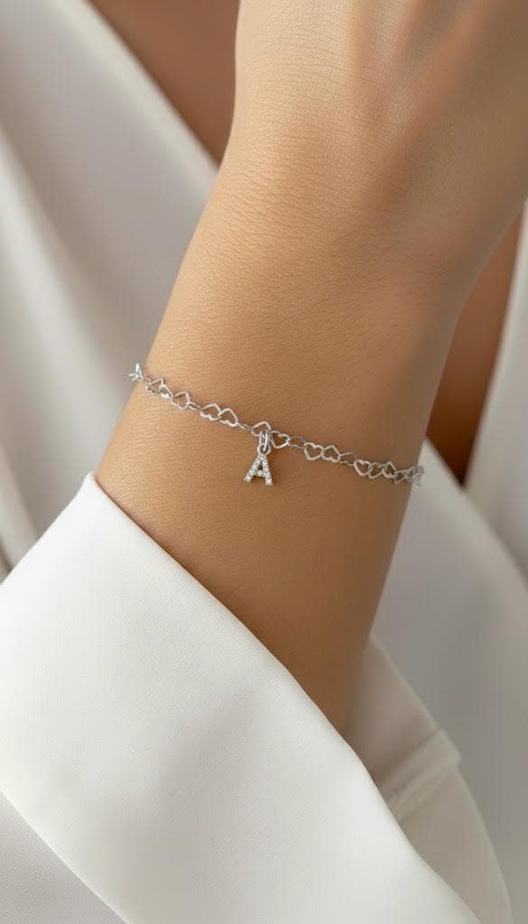 Sterling silver crystal initial bracelet with delicate heart chain.