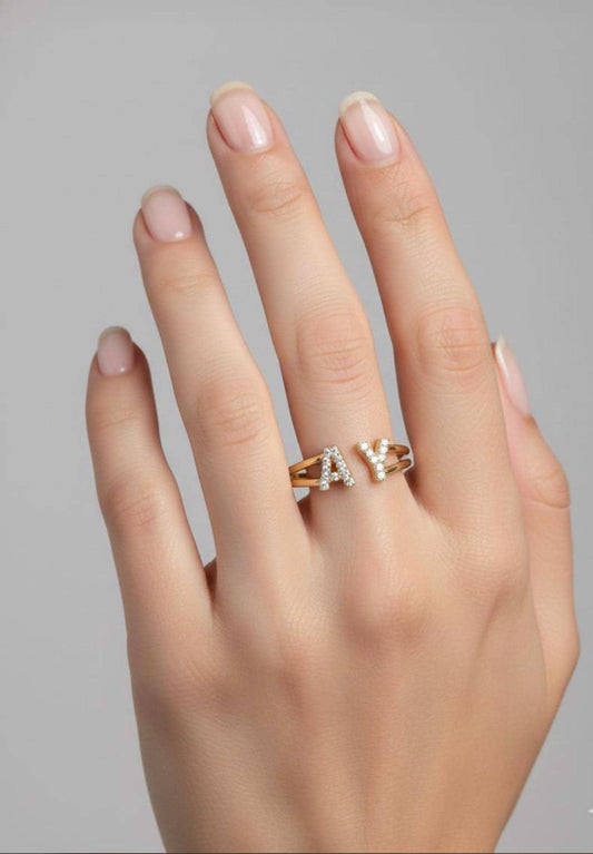 Promise ring with custom initials and gold CZ design.