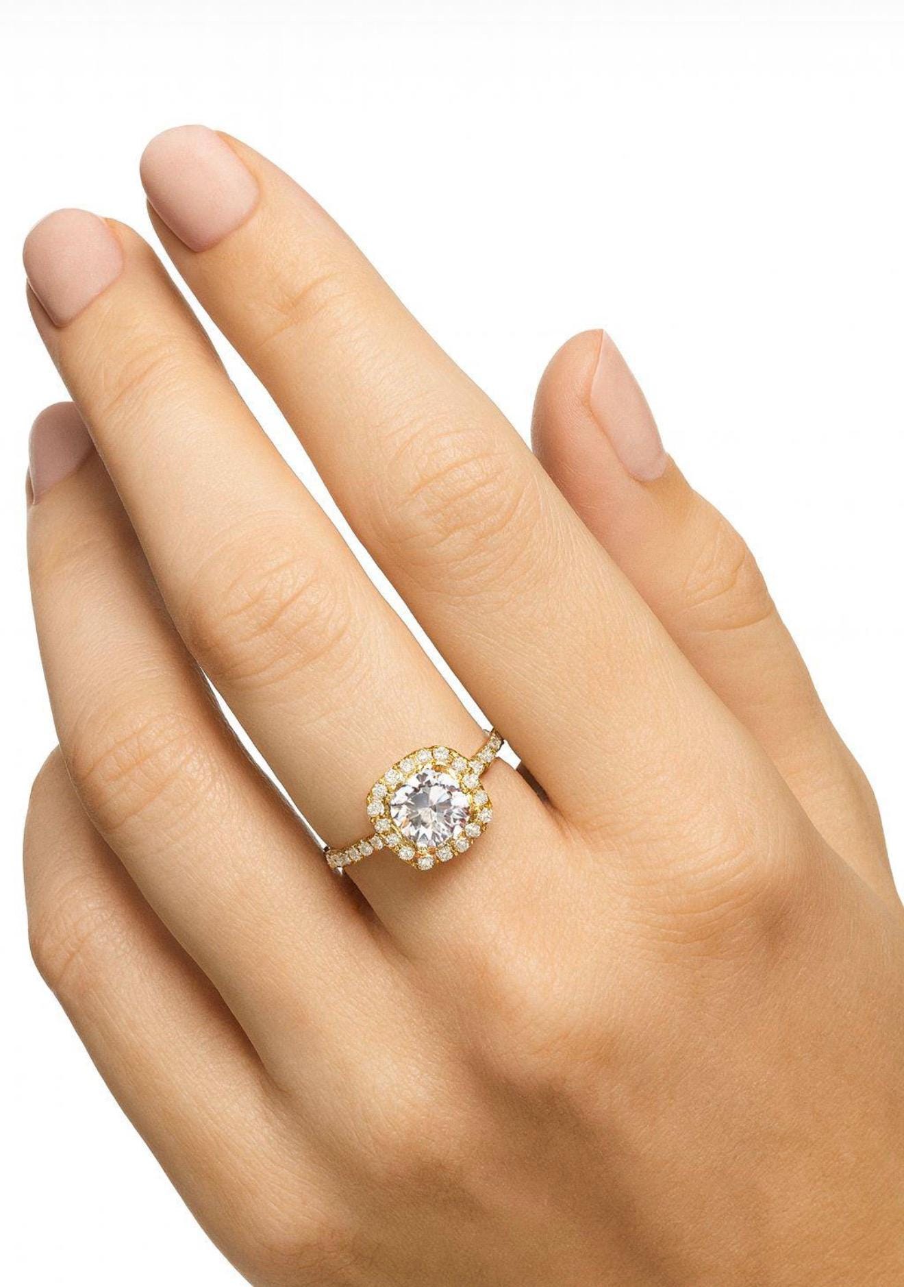 Brilliant cut CZ stone ring with gold band and personalized letters.