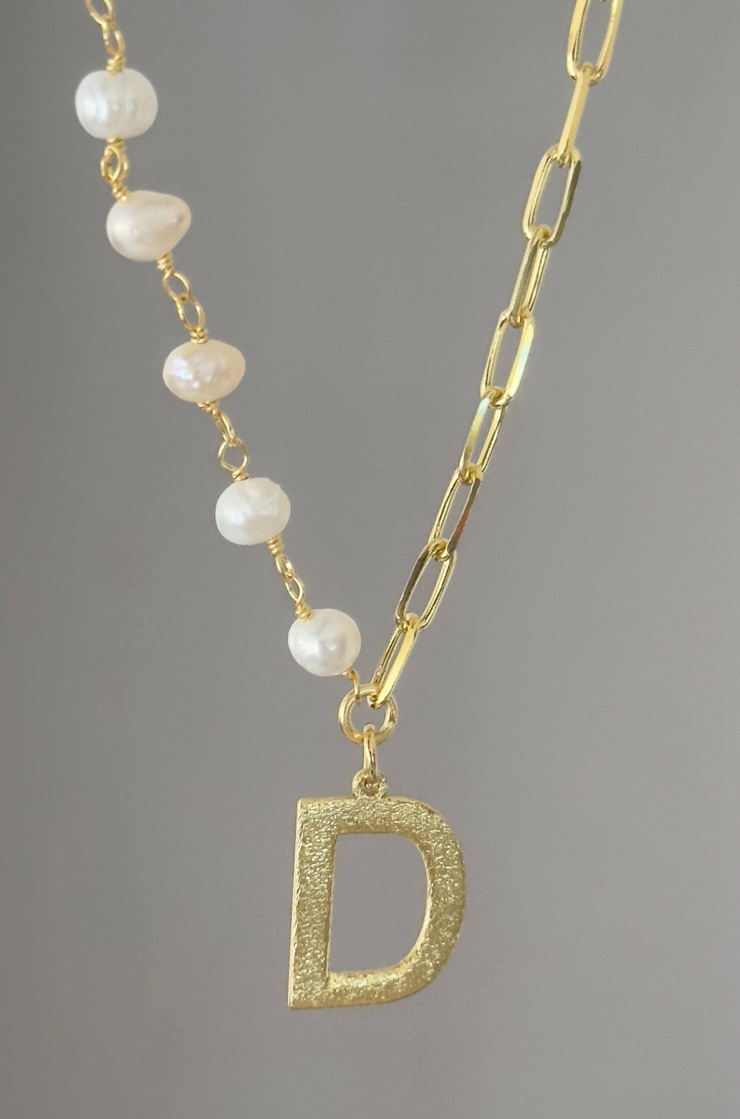 Freshwater pearl initial necklace close up