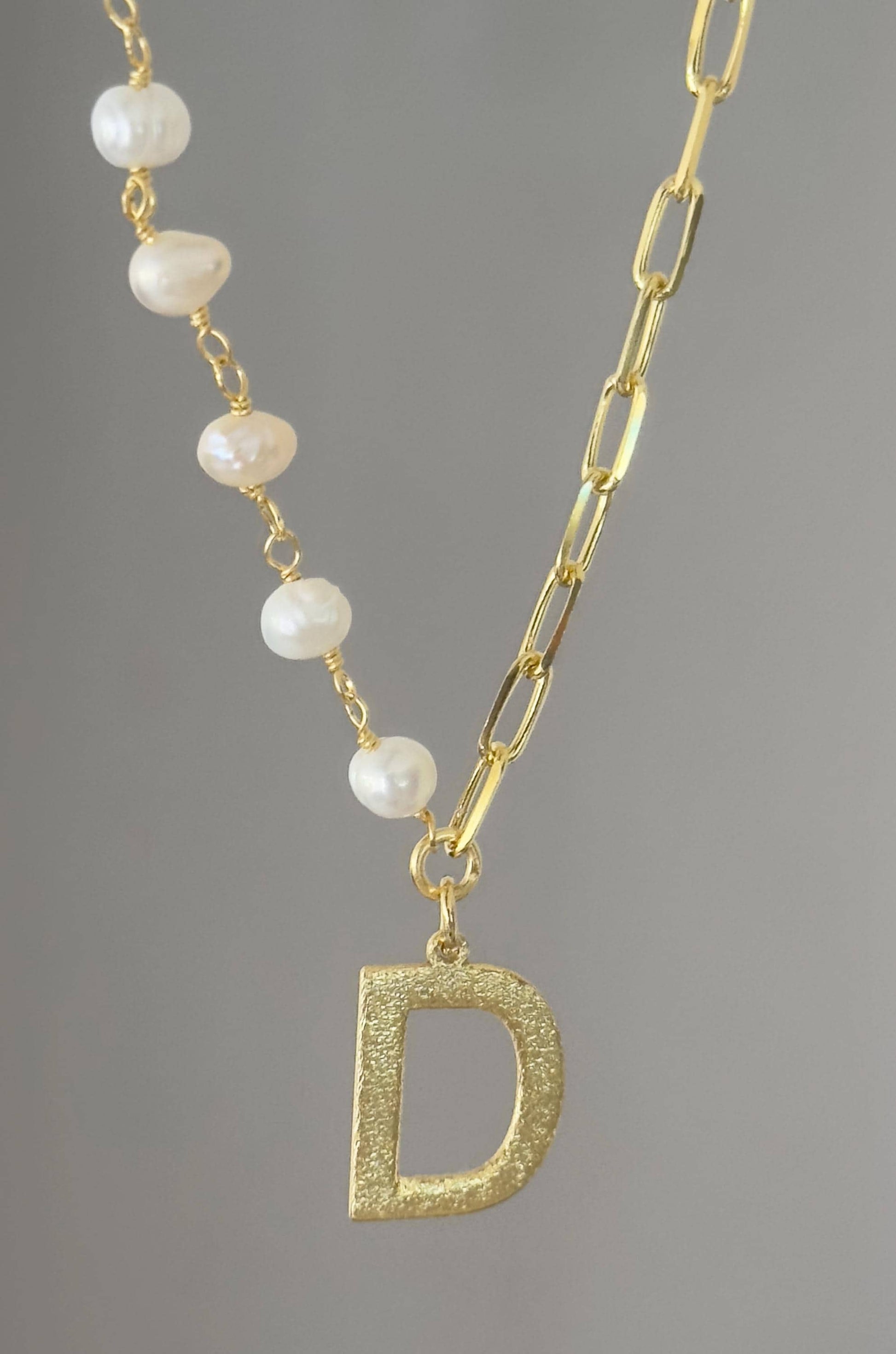 Freshwater pearl initial necklace close up