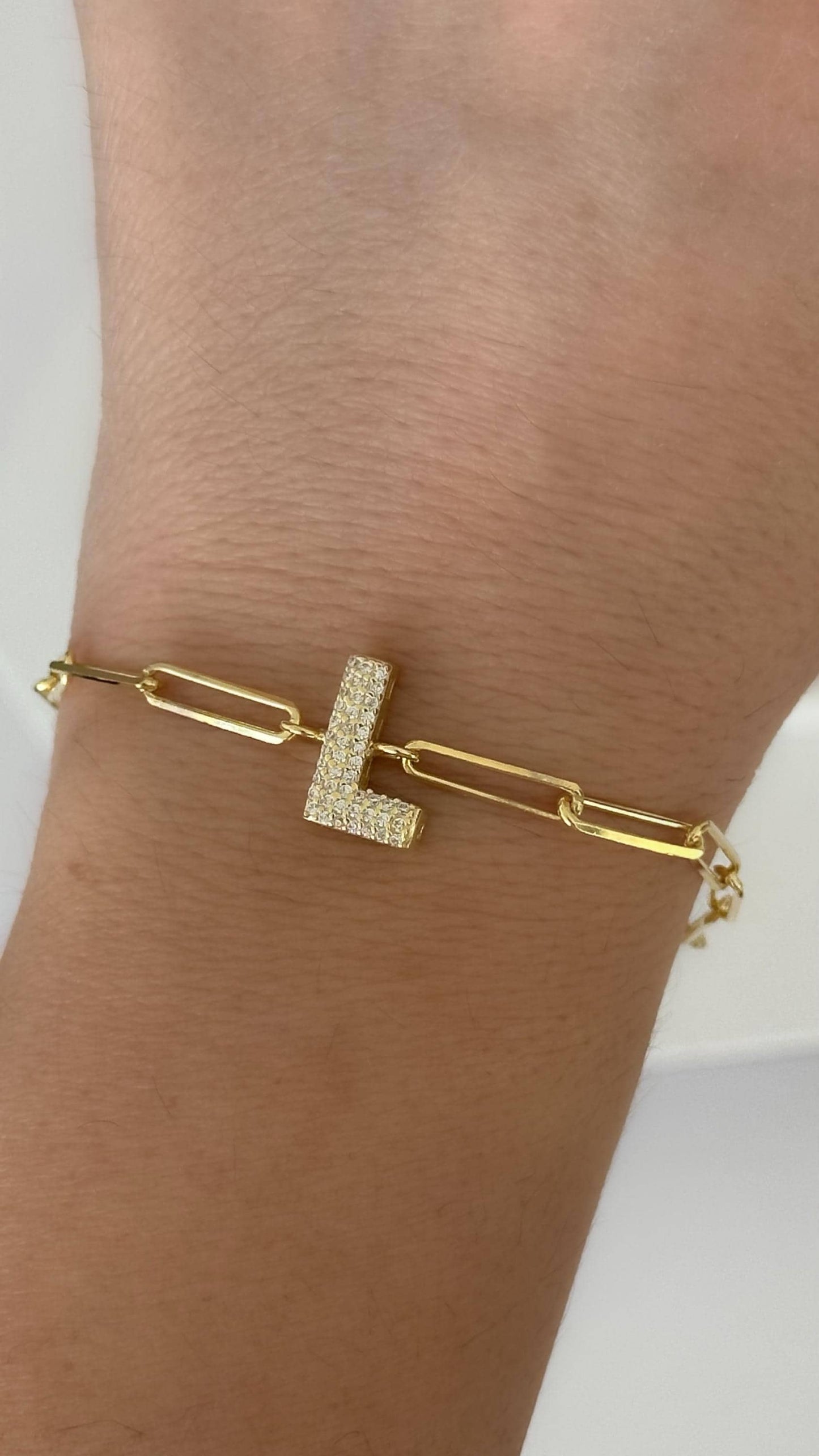 Custom gold link paperclip chain bracelet with sparkling cubic zirconia bubble diamond letter charm, handmade personalized jewelry.
