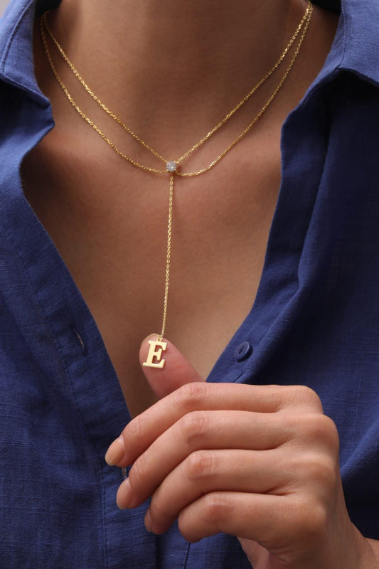 Custom initial Y-drop lariat necklace in sterling silver with CZ solitaire diamond. Personalized unique jewelry gift for birthdays, anniversaries, or bridesmaids.
