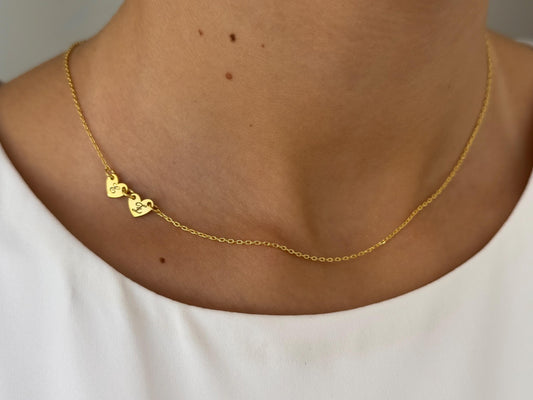 Two dainty engraved heart sideways charms necklace on a thin cable chain, personalized sterling silver jewelry.