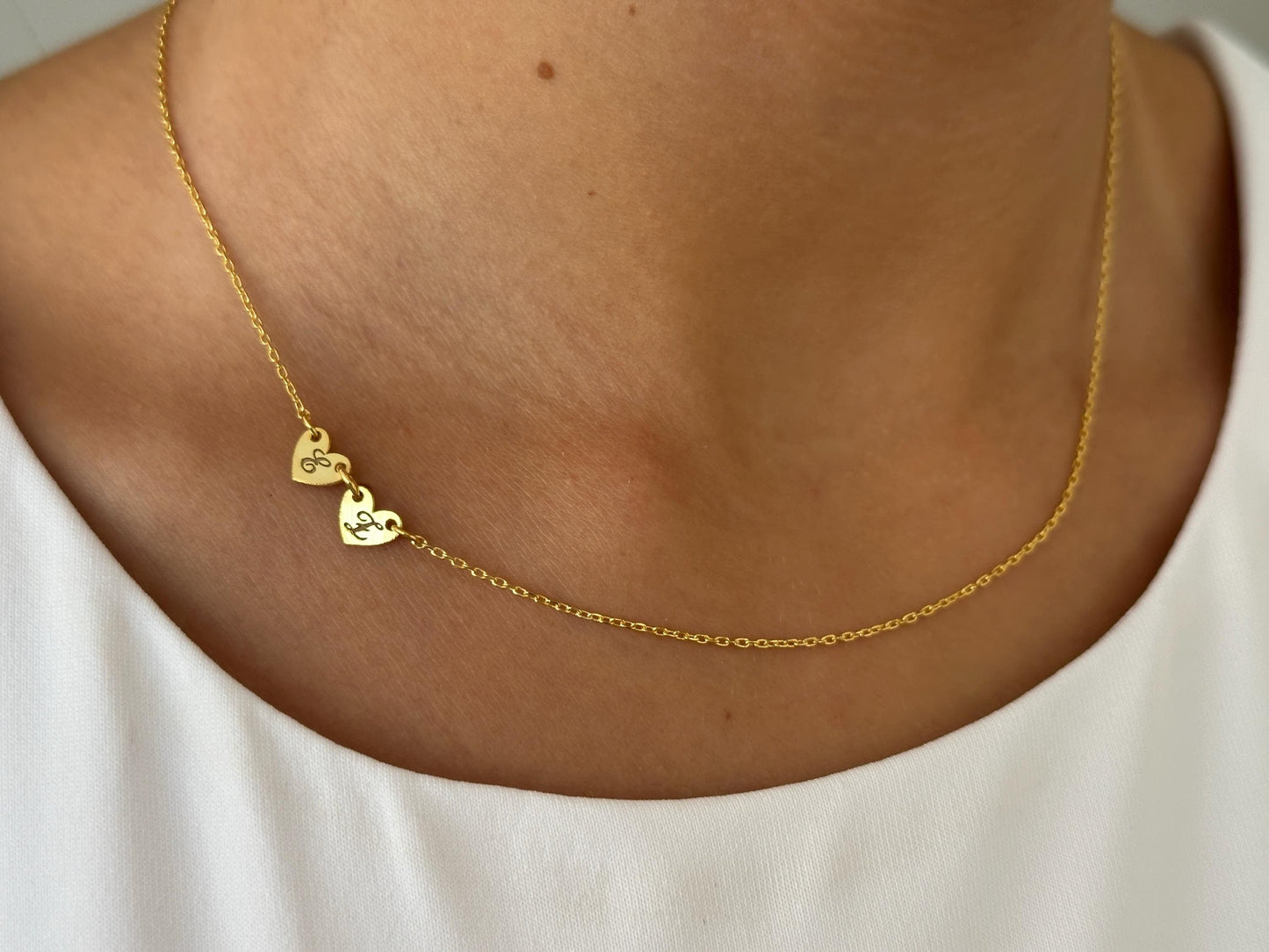 Two dainty engraved heart charms necklace on thin cable chain, personalized sterling silver jewelry.