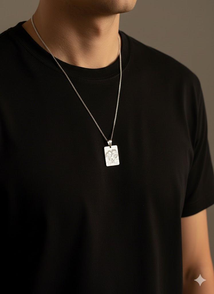 Silver portrait necklace featuring custom photo engraving.