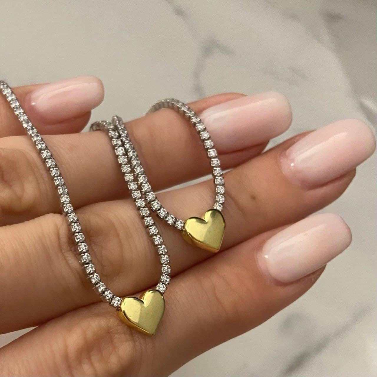 tennis chain necklace with clear gemstone heart charm