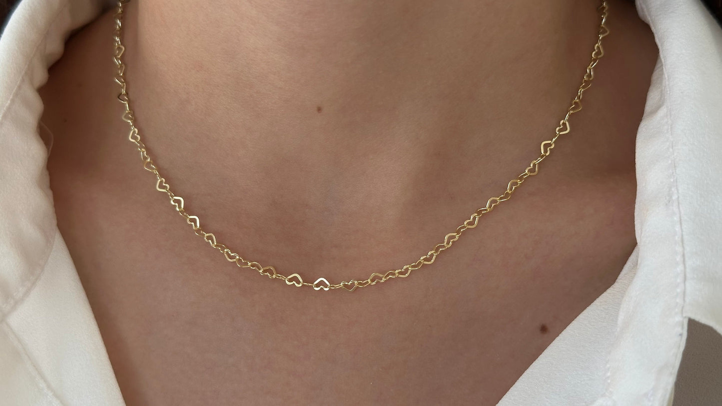 A gold necklace with a delicate chain made of small, interconnected heart shapes - minimalist jewelry 14k gold plated 925 sterling silver