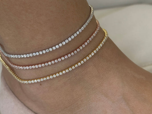Three delicate anklets with a single row of small, clear cubic zirconia stones. The anklets are shown in silver, rose gold, and gold - 925 Sterling silver jewelry gifts for her