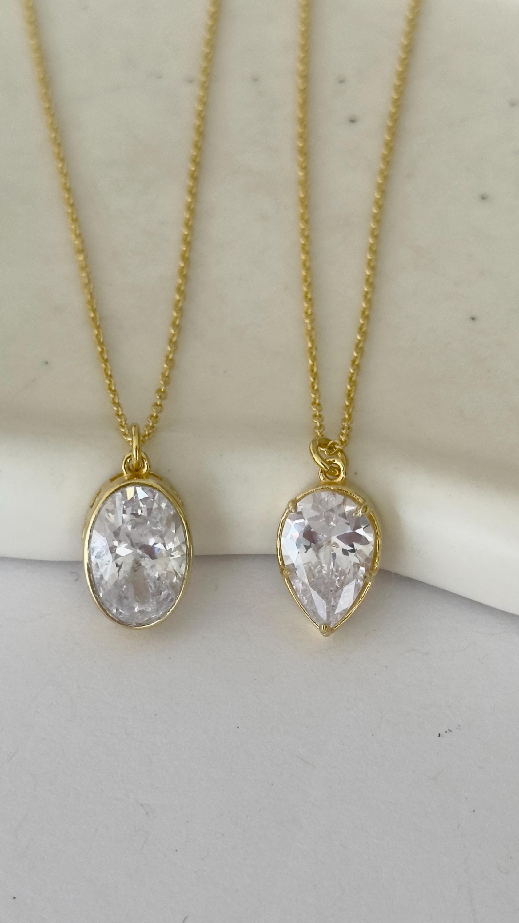 Elegant handcrafted CZ diamond necklaces in teardrop and oval shapes, 14K gold plated sterling silver minimalist design by Shineliz.