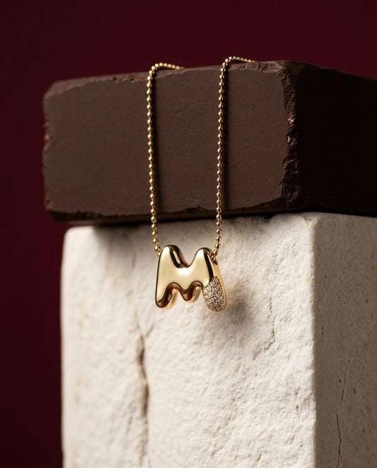 Dainty gold bubble letter initial necklace with smooth polished finish and diamond accent, personalized minimalist jewelry gift for her