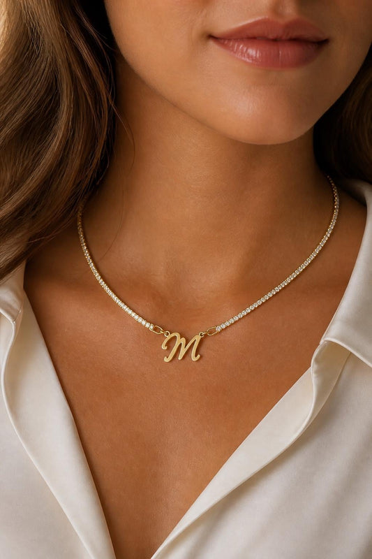 Personalized script initial tennis necklace with gold letter M pendant and sparkling diamond-style chain, crafted in 925 sterling silver for a dainty custom look.