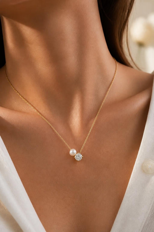 Dainty single pearl necklace with freshwater pearl and sparkling solitaire diamond pendant on a delicate gold chain, elegant bridal and everyday jewelry.
