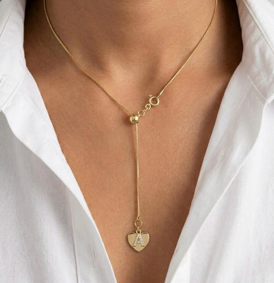 dainty gold initial lariat necklace worn on model, personalized Y necklace heart pendant