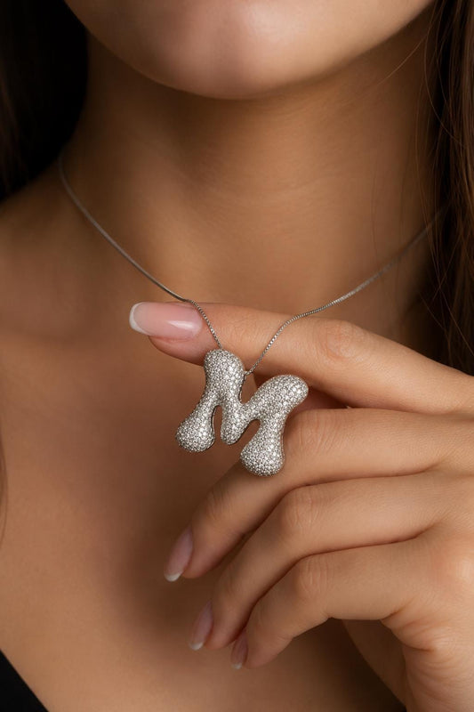 Jumbo bubble letter M necklace featuring pavé CZ stones, personalized statement initial pendant jewelry.