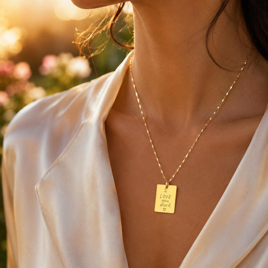 Woman wearing a personalized handwriting necklace engraved with an actual handwritten love note. Custom gold keepsake pendant created from your own handwriting, perfect for memorial jewelry, anniversary gifts, couples, loved ones, and meaningful everyday wear.