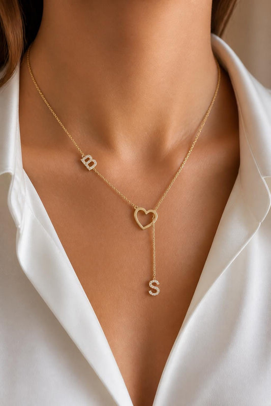 Personalized initial heart lariat necklace in 14K gold plated sterling silver with two sparkling diamond letter charms, open heart center and Y drop chain, custom necklace and meaningful gift for her.